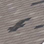 #2 Shingle tabs in various areas have been completely removed during a high wind thunderstorm.